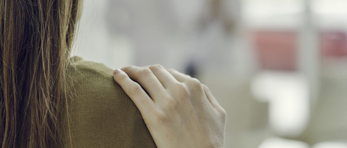 Patient comforted by healthcare worker